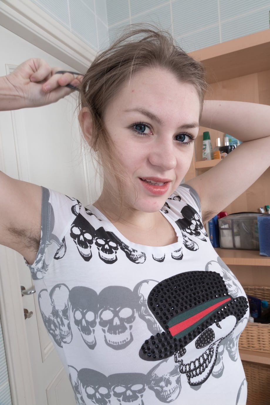 Young amateur unveils her hairy pussy while getting naked to bathe