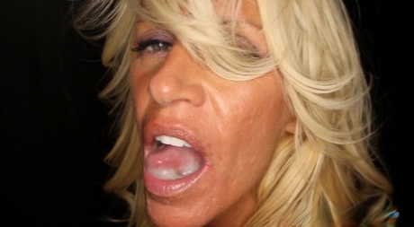 Mature MILF Gina plays with a mouthful of cum after gloryhole suck off