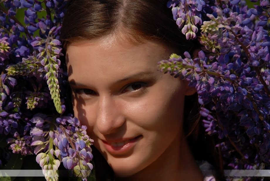 Naked youth Nikki D proudly displays her nude beauty dappled with soft wildflower petals - 3