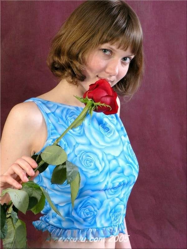 Rose A strips seductively with a single crimson rose in hand - 1
