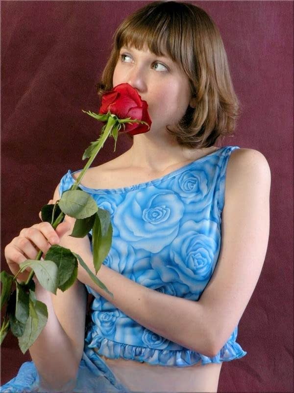 Rose A strips seductively with a single crimson rose in hand - 2