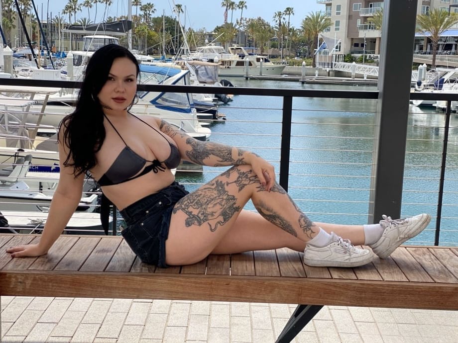 Tattooed temptress Brynn Michaels strips off bikini outdoors and rides thick cock on yacht - 2