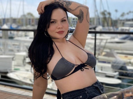 Tattooed temptress Brynn Michaels strips off bikini outdoors and rides thick cock on yacht - 4
