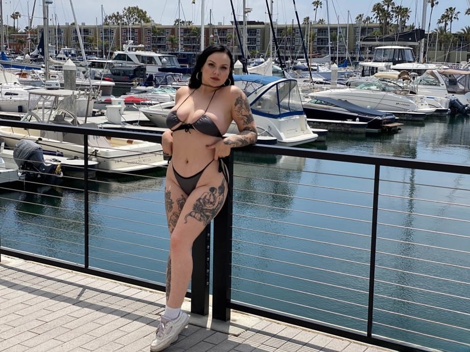 Tattooed temptress Brynn Michaels strips off bikini outdoors and rides thick cock on yacht - 8