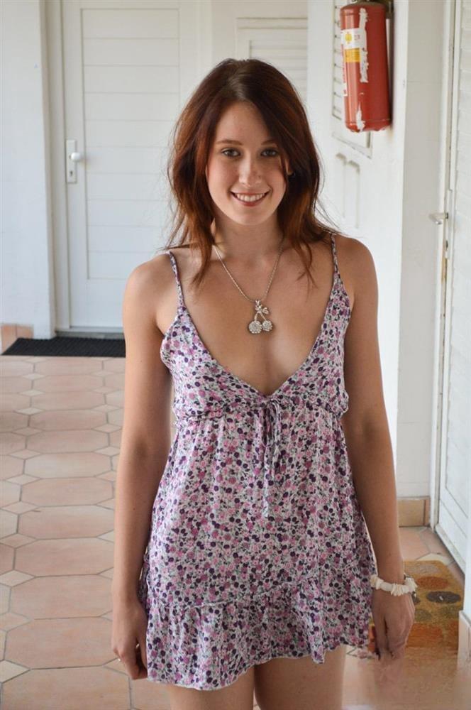 Fair skinned girl hikes up her dress to show her pussy in white stockings