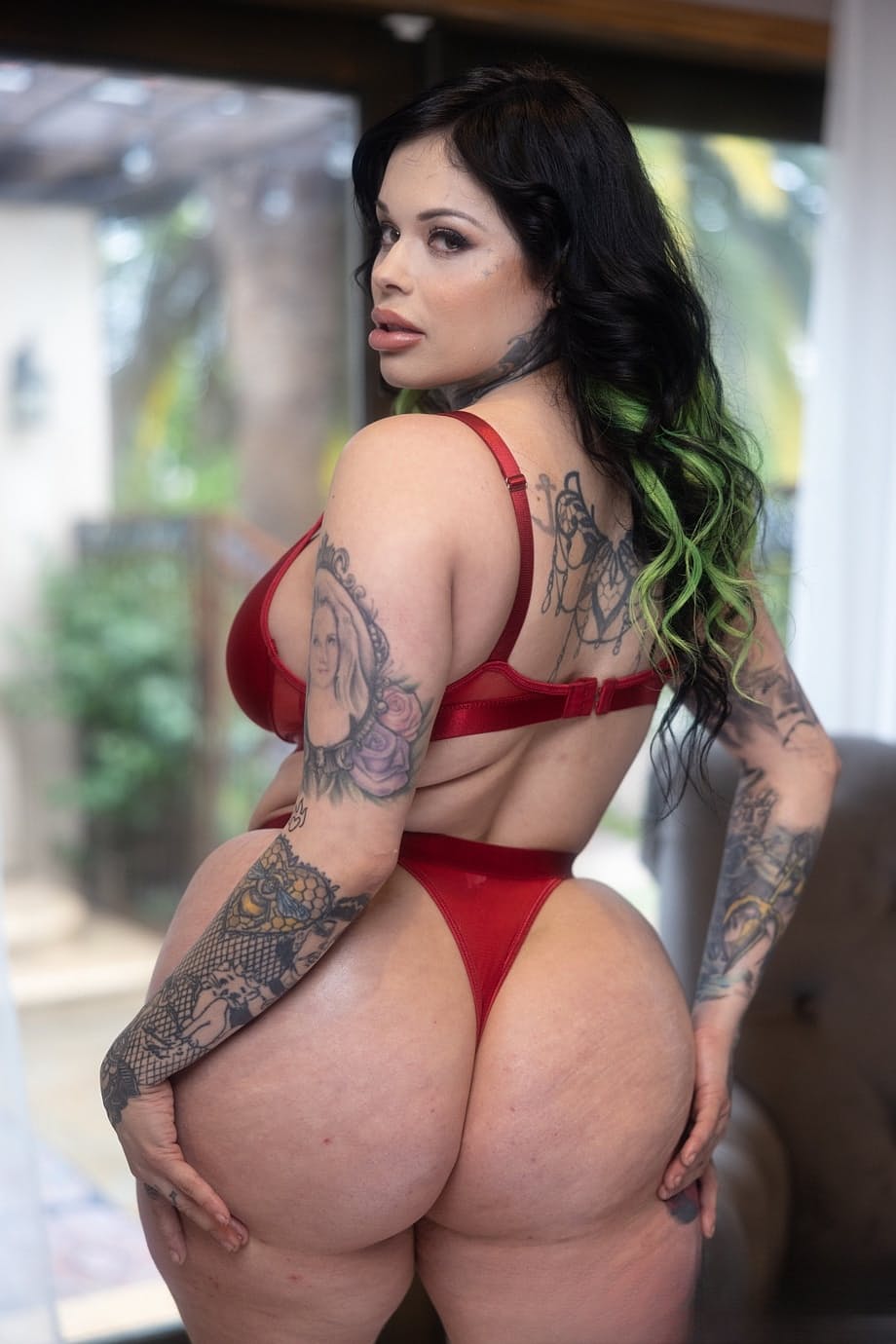 Tattooed Latina MILF Xwife Karen poses by herself before fucking on a bed