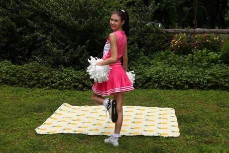 Teen cheerleader Bella Nova aggressively pounding her tight asshole with a huge dildo on her soft blanket - 2