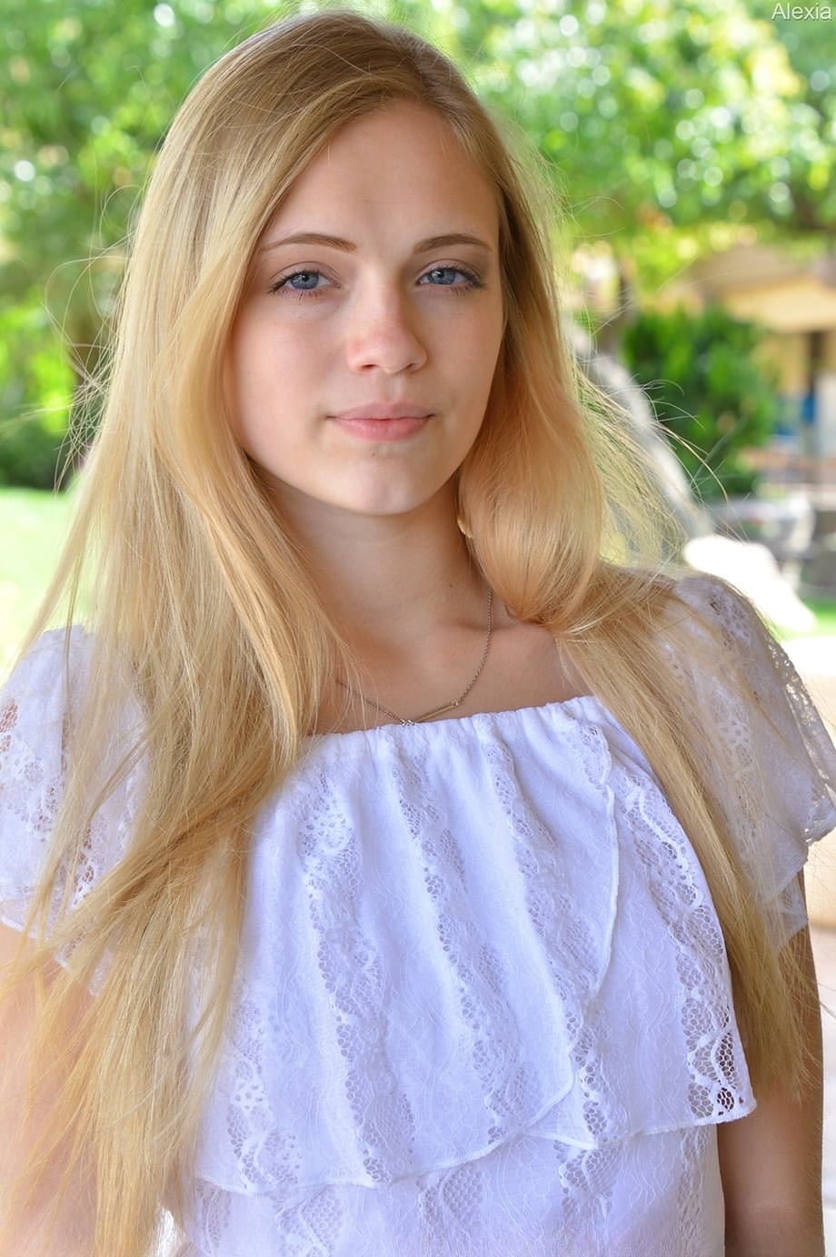 Blonde amateur Alexia goes nude on a bed and a public street as well