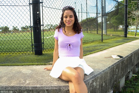 Isabella Jules exposes her fake Latina tits in pristine white skirt and sneakers - 1