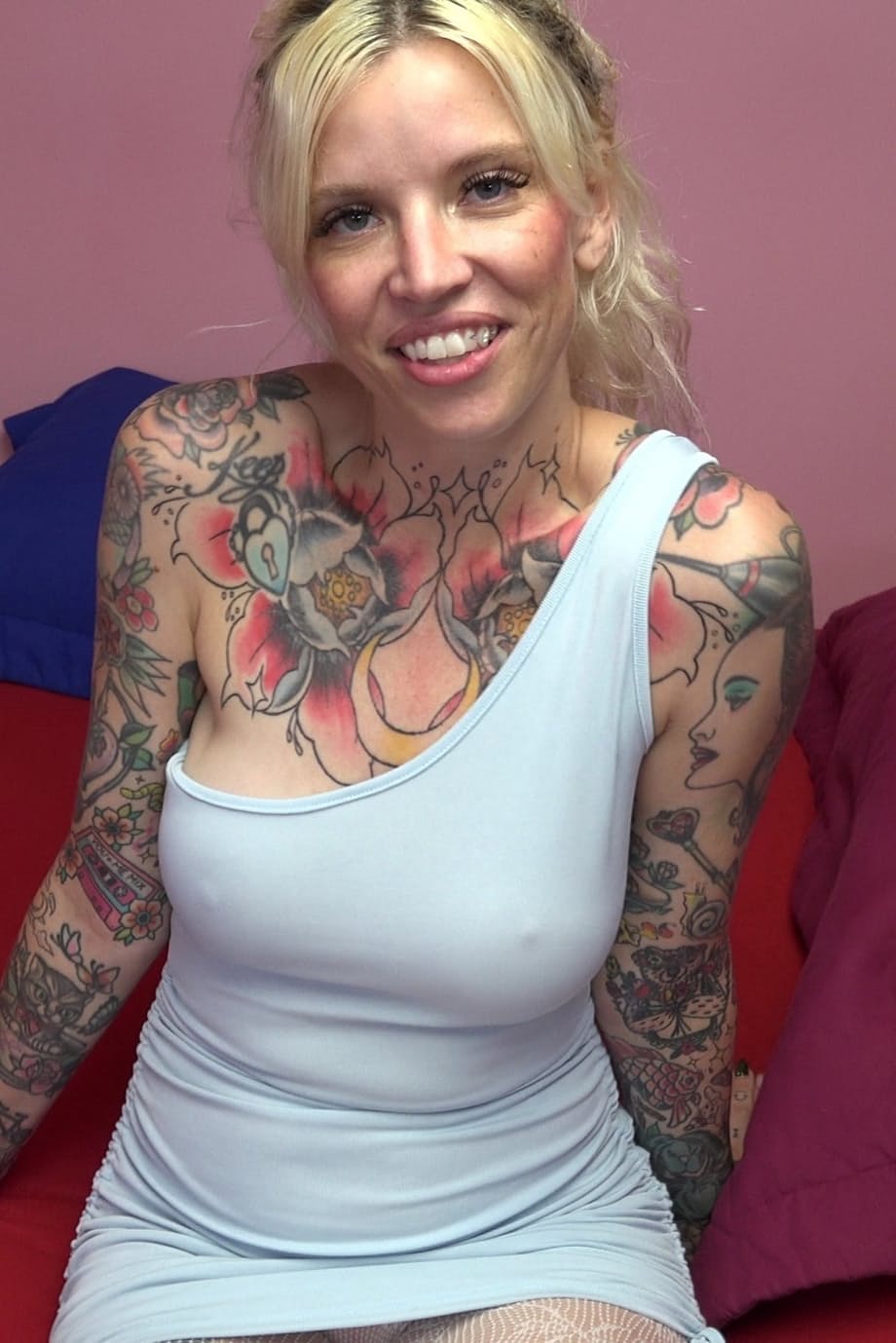 Kitt Jones legs spread teasingly over huge cock while her sheer pantyhose stretch around her tattooed curves - 1