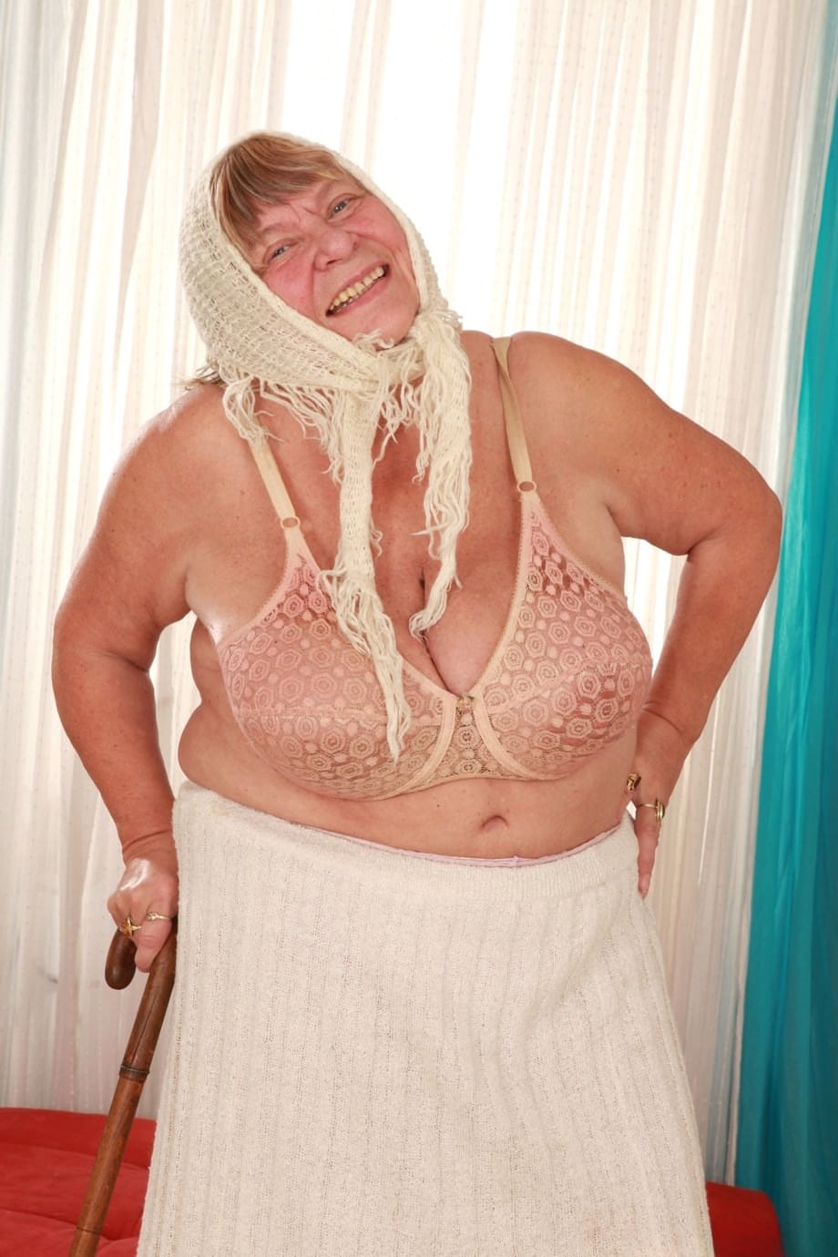 Sara G mature vixen removes top revealing massive boobs in sultry bra - 15