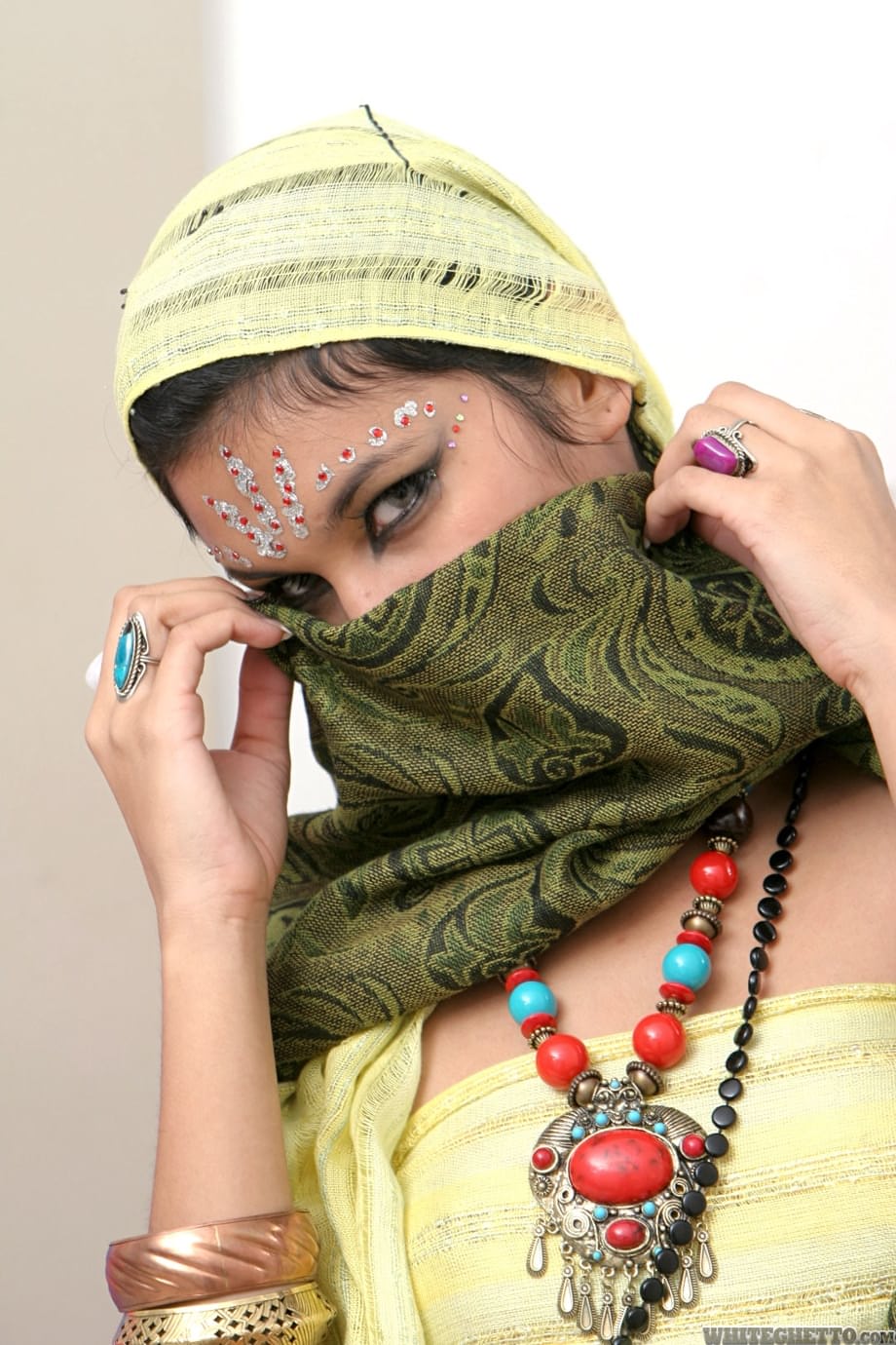 Fully clothed Indian female Yesica uncovering her forbidden face