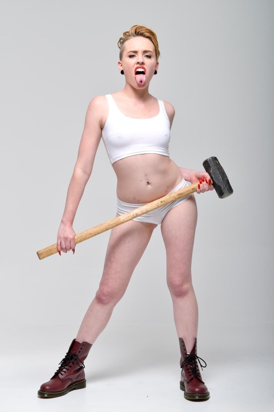 Miley May strips her white panties flashing pierced tongue - 7