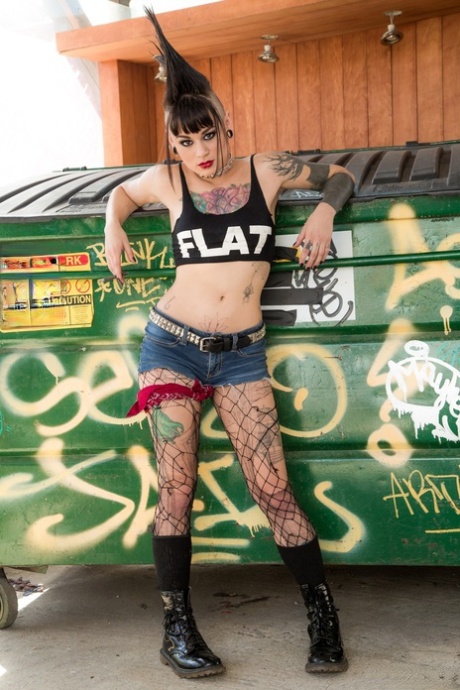Tattooed punk rocker Amelia Dire seductively strips and flaunts her shaved naked body with bold Mohawk hair - 1