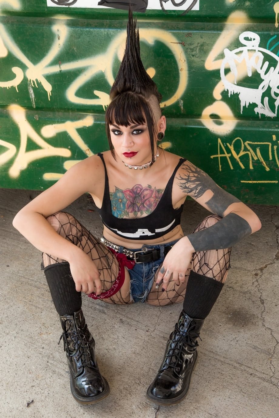Tattooed punk rocker Amelia Dire stripping nude with hair in Mohawk