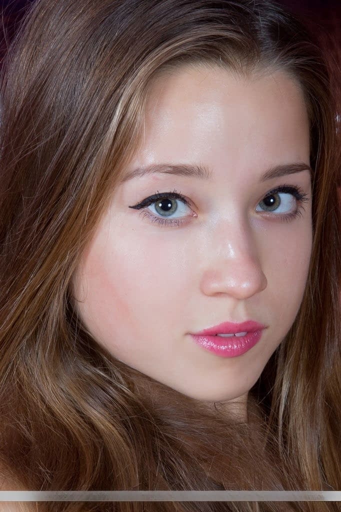 Tiny tits Euro teen Taissia A stretches and spreads her naked pussy lips