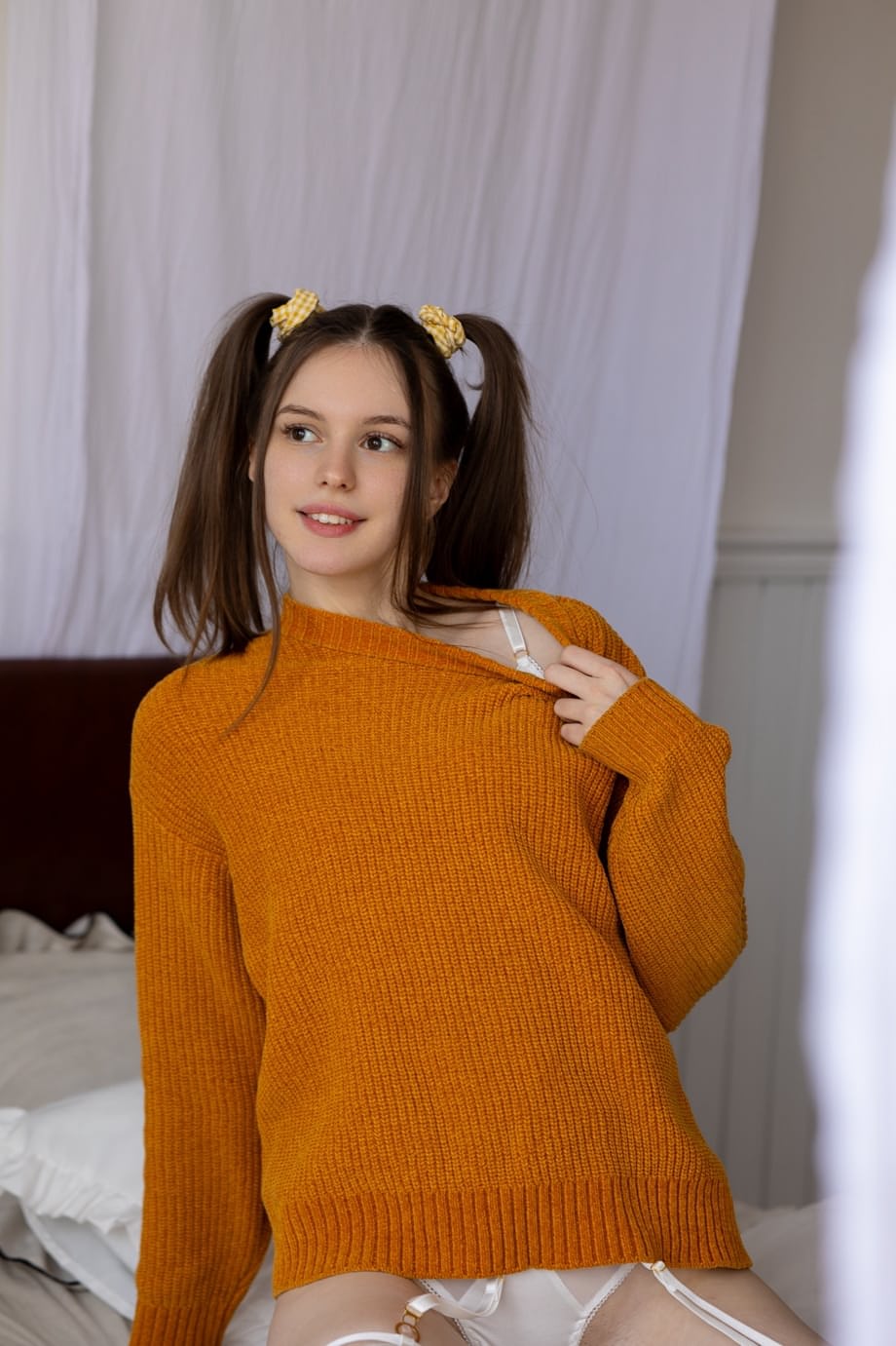 Brunette amateur shows her fake tits while wearing a sweater over sexy underwear