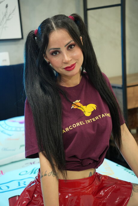 Teh Angel models fetish clothing prior to interracial fucking