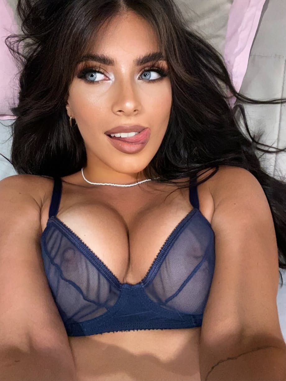 Latina girl Ximena Delgado models bra and thong ensembles in a teasing manner