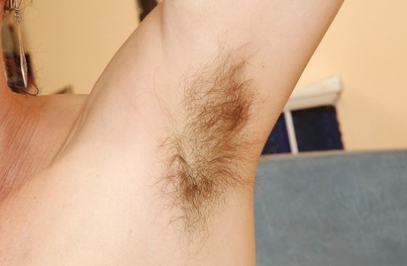 Horny redhead MILF Debra strips nude exposing hairy armpits and dripping bush - 15