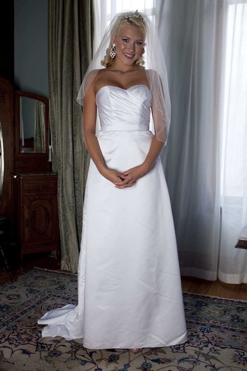 Busty blonde bride Katie Summers strips her wedding gown revealing perky breasts in sexy sheer lingerie - 1