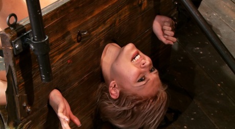Katie Summers trapped in wicked wooden stocks getting fingerfucked - 7