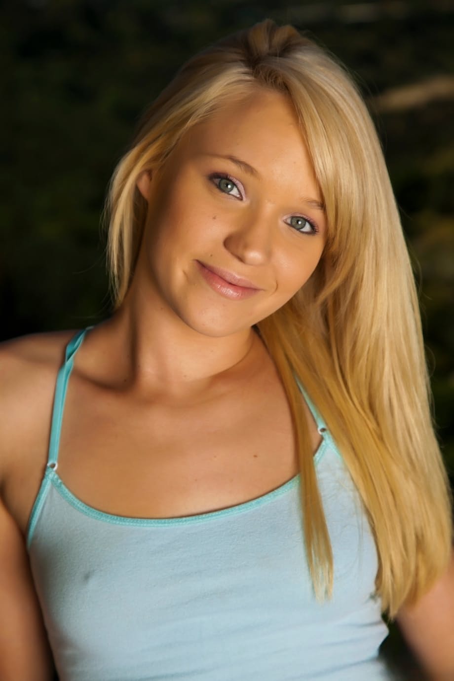 Cute blonde teen Tegan Summers sticks a toy in her shaved pussy