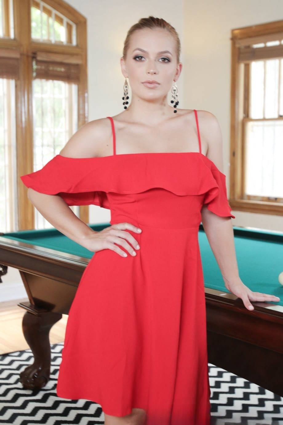 Long haired blonde in ponytail Sloan Harper shows her hot stuff on pool table