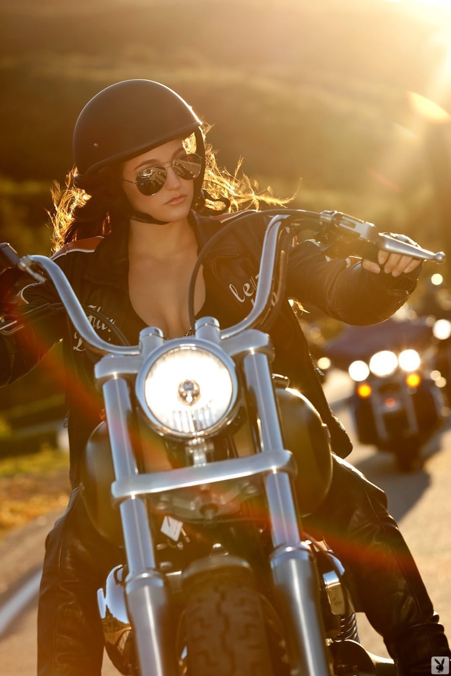 Sultry Jaclyn Swedberg nude on black Harley, glistening skin, bedroom eyes - 2