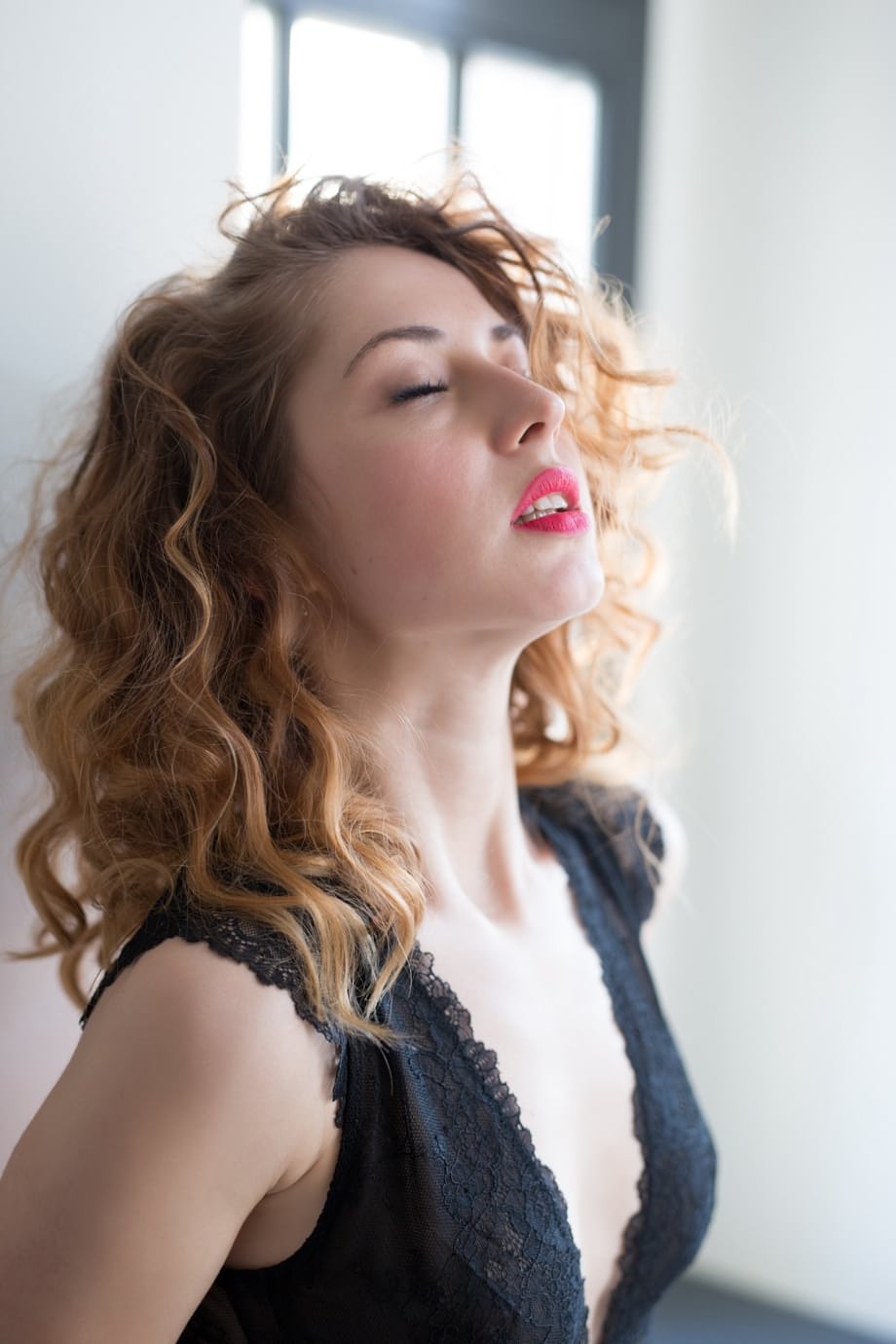 Curly haired chick in sexy black lingerie Diana Lark shows off her tiny chest