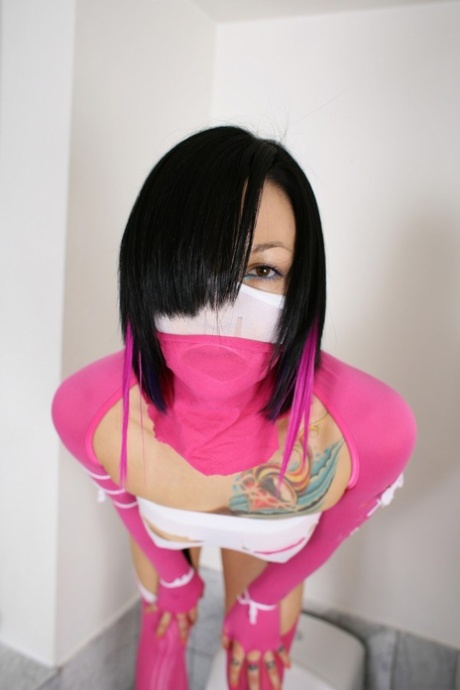 Belladonna dominates masked man with pink strap-on in steaming bathroom - 1