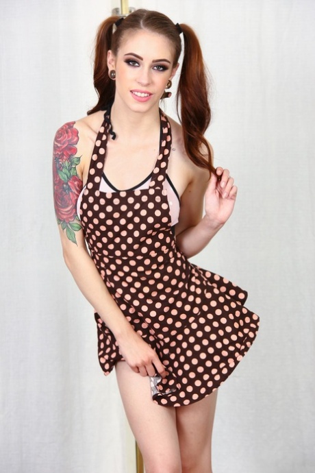 Pigtailed sweetie Anna peels her skinny tattooed body to spread pussy naked