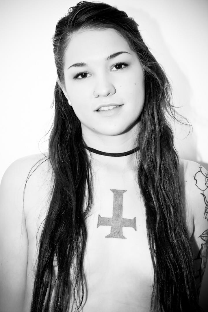 Zarrah the tattooed goth babe seductively fingers her petite boobs and smooth slit - 1