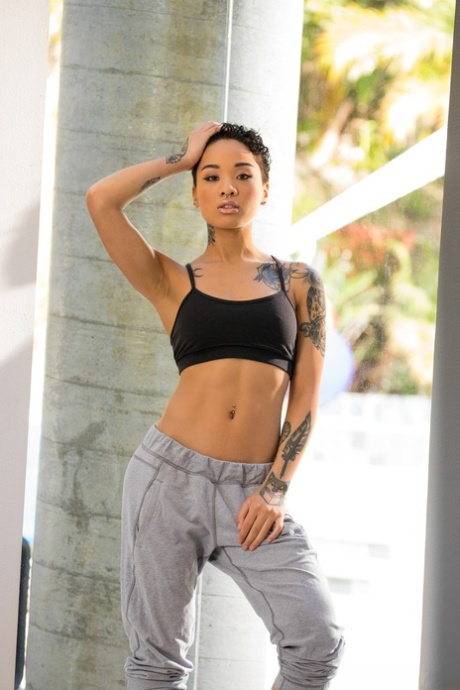 Fitness vixen Honey Gold peels away tiny gym wear to unveil every inch and tattoo - 8
