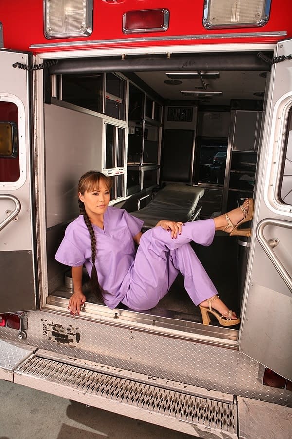 Mia Smiles strips off her tiny nurse uniform and seductively exposes her smooth Asian body inside the ambulance - 2