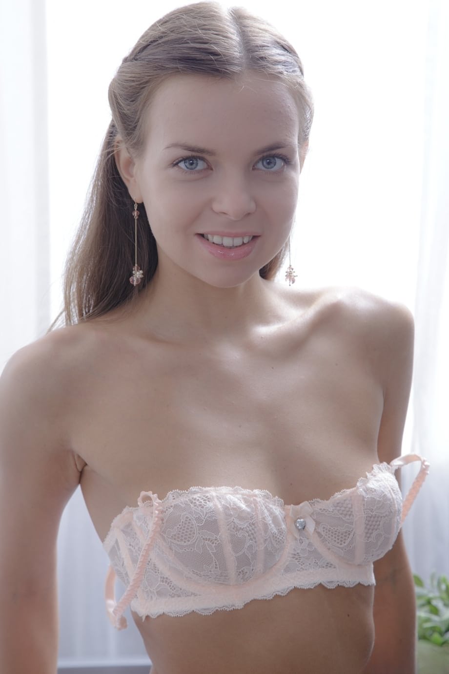 Teen model Carre fingering her pussy in her sexy white stockings in the chair