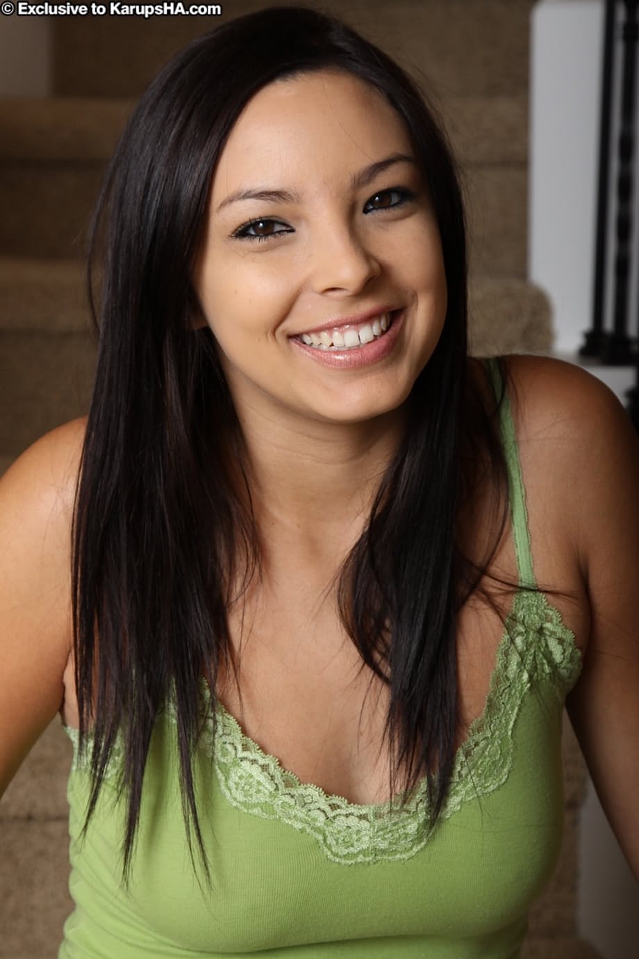 Tall girl Danni Cole works clear of her clothes to go nude on the stairs
