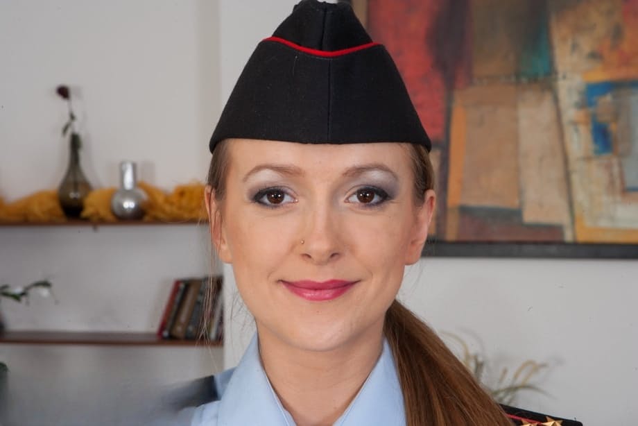 Sultry officer Violet Moon seductively reveals perfect ass and natural tits in bedroom - 1