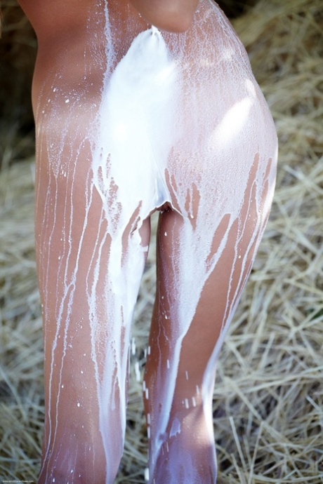 Paglia Nude Teen Blonde Covers Her Slender Body With Fresh Milk On Straw Bale - 6
