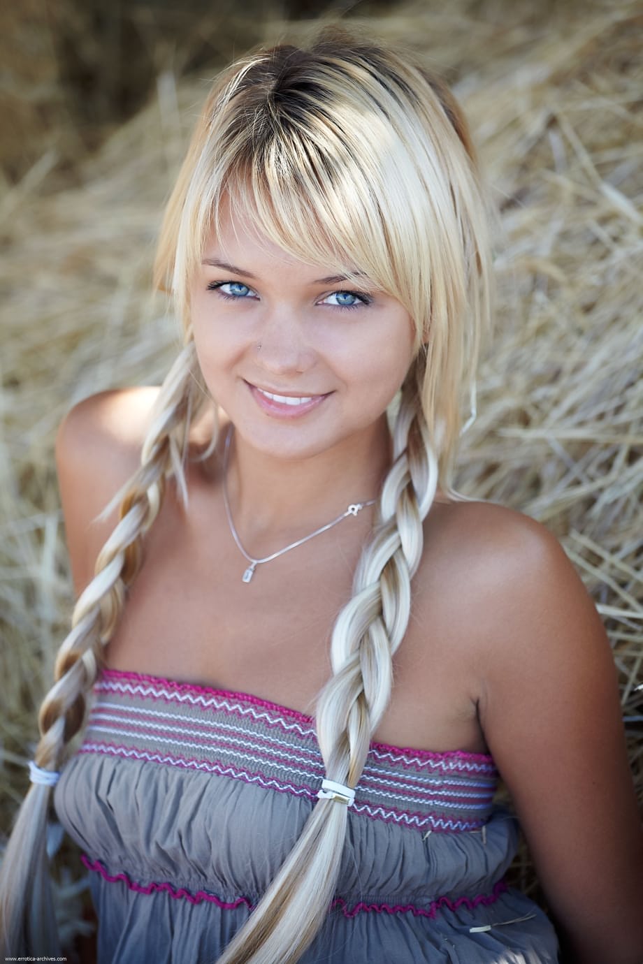 Alluring blue-eyed teen Lada strips and shows her boobs and holes in the hay