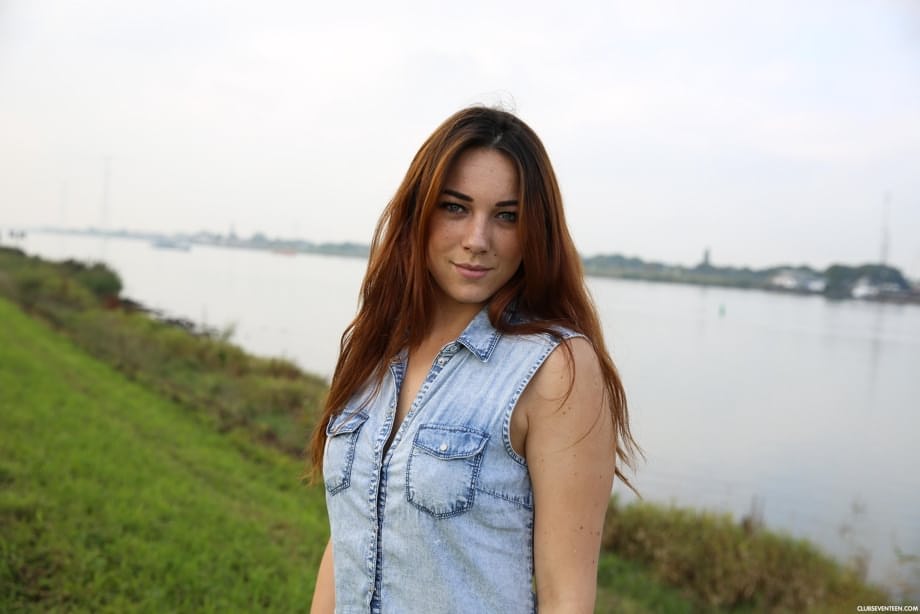 Zoe Davis shows off her huge natural tits and firm ass outdoors beside the farm tractor in a kinky Dutch display - 15