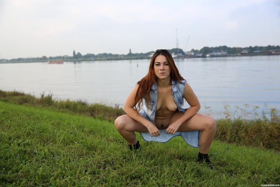 Zoe Davis shows off her huge natural tits and firm ass outdoors beside the farm tractor in a kinky Dutch display - 18