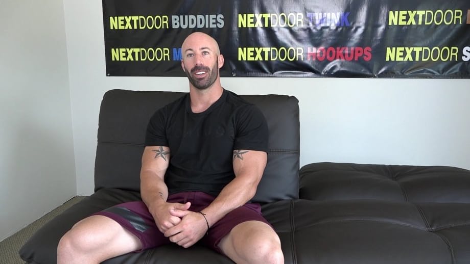 Bald muscular gay man Max King exposes his dick and masturbates