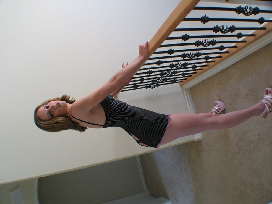 Exquisite MILF temptress Kelly Wells seductively strips her lingerie on the staircase - 8