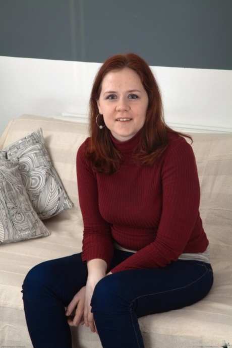 Kathy reveals her trimmed ginger pussy after stripping off tight jeans - 1