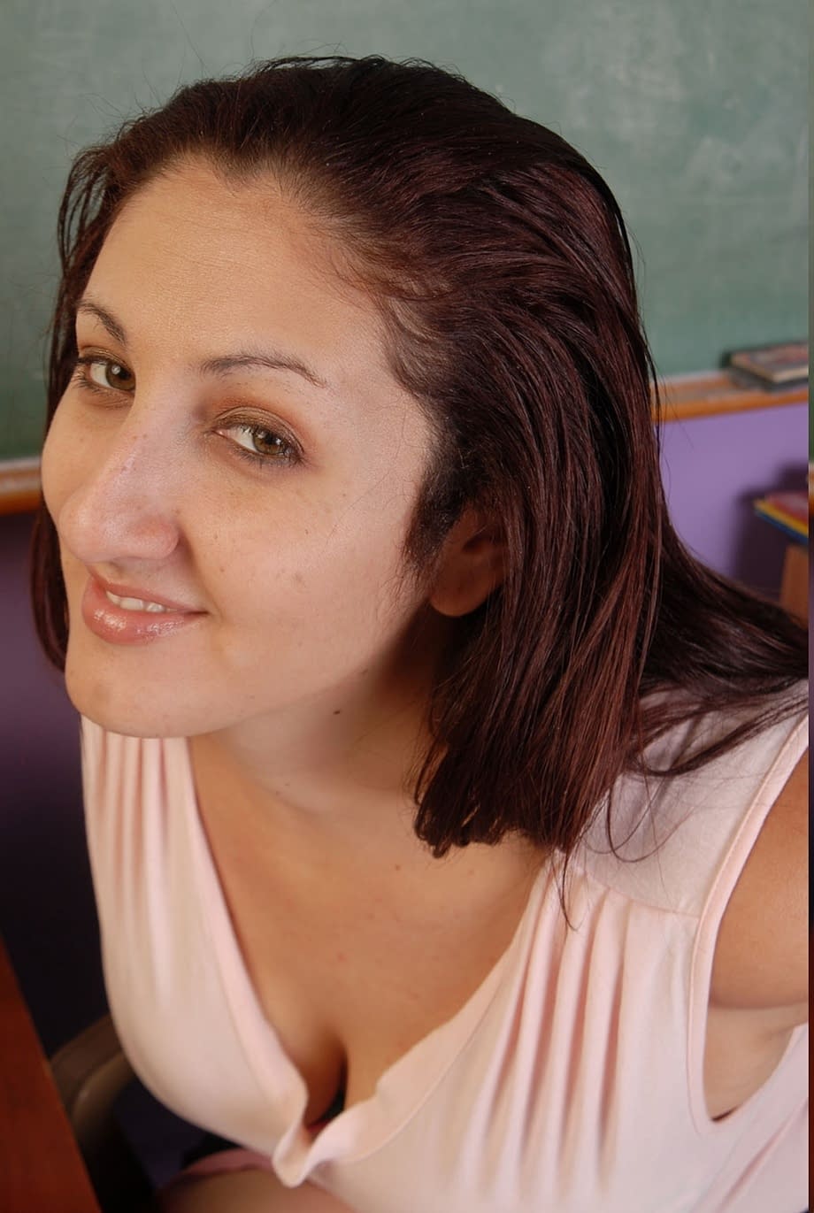 Busty Sonia strips in the classroom revealing big tits and hairy pussy - 1