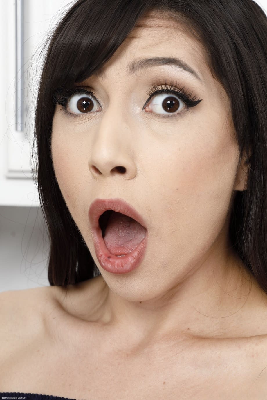 Brunette solo girl Judy Jolie spreads her trimmed pussy wide open