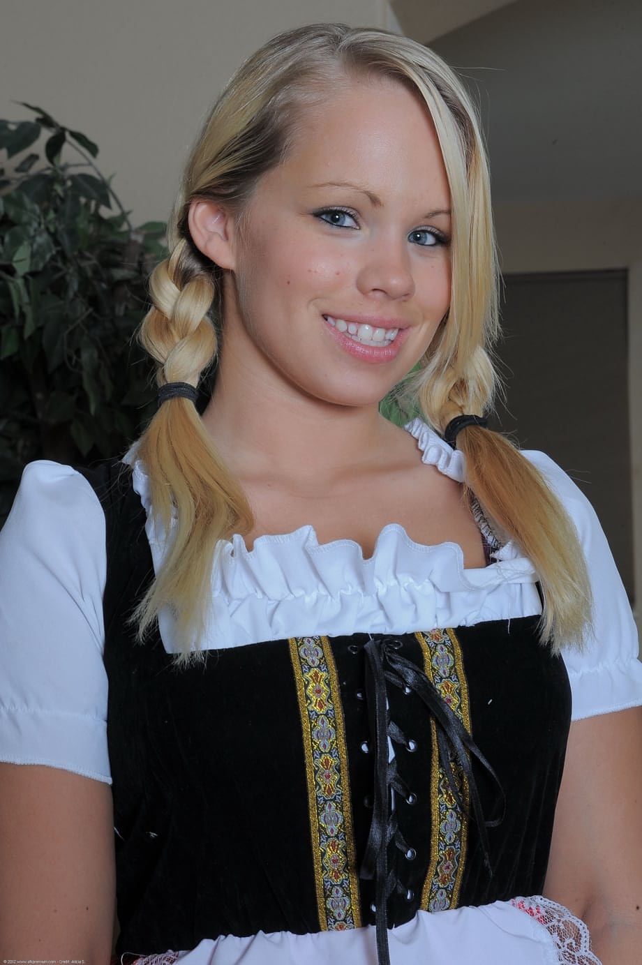 Blonde teen Britney Young exposes her vagina while removing a maid uniform