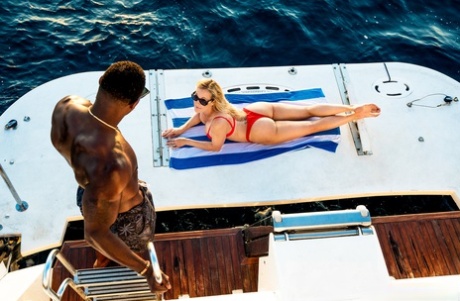 Naughty Brandi Love straddles black cock wildly on a swaying yacht deck - 1
