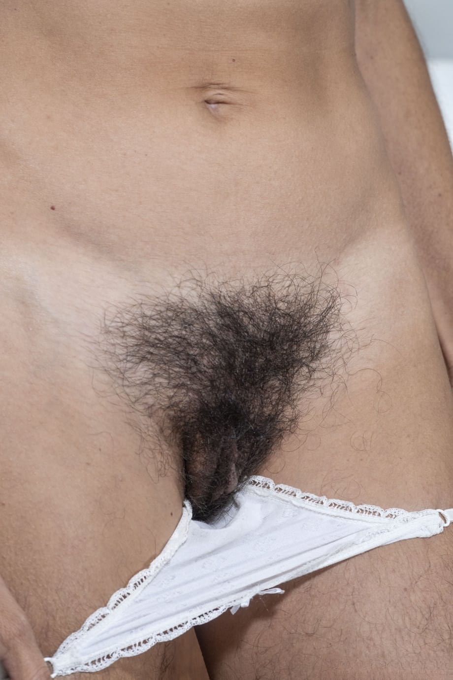Amateur mom with tiny tits Bruna undressing and flaunting her hairy twat